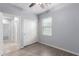 Cozy bedroom featuring hardwood floors, closet with sliding doors, and plenty of natural light at 5550 N 16Th St # 166, Phoenix, AZ 85016