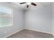 Bright bedroom with a ceiling fan and light hardwood flooring, offering ample natural light at 5550 N 16Th St # 166, Phoenix, AZ 85016