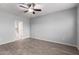 Spacious bedroom featuring hard wood floors and a ceiling fan, leading to an attached bathroom at 5550 N 16Th St # 166, Phoenix, AZ 85016