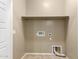 Neutral closet with shelves, with connections for a washer and dryer, and beige tiled floors at 5550 N 16Th St # 166, Phoenix, AZ 85016