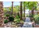 Beautiful community landscaping with mature palm trees and wrought iron fence, with sidewalks at 5550 N 16Th St # 166, Phoenix, AZ 85016