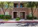 Inviting townhome showcasing a stone facade, well-maintained landscaping, and a private entryway at 5550 N 16Th St # 166, Phoenix, AZ 85016