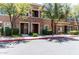 Inviting townhome showcasing a stone facade, well-maintained landscaping, and a private entryway at 5550 N 16Th St # 166, Phoenix, AZ 85016