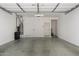 Spacious two-car garage featuring epoxy floor, water heater, and ample room for parking at 5550 N 16Th St # 166, Phoenix, AZ 85016
