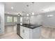 Open-concept kitchen island with stainless steel appliances and sink, with open living spaces at 5550 N 16Th St # 166, Phoenix, AZ 85016