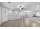 Bright living room showcasing wood-look floors, a ceiling fan, and an open floorplan at 5550 N 16Th St # 166, Phoenix, AZ 85016