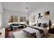 Bright primary bedroom features hardwood floors, vaulted ceilings and modern decor at 592 W Harvard Ave, Gilbert, AZ 85233