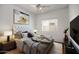This bedroom features a tufted headboard, neutral colors, and lots of natural light at 592 W Harvard Ave, Gilbert, AZ 85233