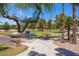 The community park includes picnic tables and seating near trees and open grassy areas at 592 W Harvard Ave, Gilbert, AZ 85233