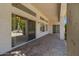 A large covered patio with access to the back yard and sliding doors into the home at 592 W Harvard Ave, Gilbert, AZ 85233