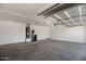 Clean two-car garage, with a water heater and a door to access the side of the house at 592 W Harvard Ave, Gilbert, AZ 85233