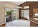 Bright breakfast nook featuring tile floors and sliding glass doors to the patio at 592 W Harvard Ave, Gilbert, AZ 85233