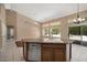 Open kitchen island featuring granite countertops, stainless steel appliances, and breakfast bar at 592 W Harvard Ave, Gilbert, AZ 85233