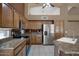 Kitchen with stainless steel appliances, granite countertops, and ample cabinet space at 592 W Harvard Ave, Gilbert, AZ 85233