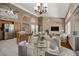 Open-concept living space with an island, high ceilings, neutral colors and modern decor at 592 W Harvard Ave, Gilbert, AZ 85233