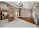 An open living area with tile and wood flooring, ceiling fans, and lots of light at 592 W Harvard Ave, Gilbert, AZ 85233