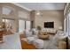 Open-concept living area featuring neutral tones, modern furniture and vaulted ceilings at 592 W Harvard Ave, Gilbert, AZ 85233