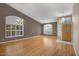 Bright living room with hardwood floors, plantation shutters, and a warm, inviting ambiance at 592 W Harvard Ave, Gilbert, AZ 85233