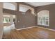 Living area featuring hardwood floors, elegant chandelier, and an open view into the rest of the home at 592 W Harvard Ave, Gilbert, AZ 85233