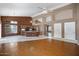 Open-concept living room with hardwood floors, a central island, and seamless transition into the kitchen at 592 W Harvard Ave, Gilbert, AZ 85233
