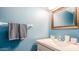 Clean, well-lit bathroom featuring a modern sink, decorative mirror, and fresh towels at 6945 E Osborn Rd # B, Scottsdale, AZ 85251