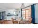 Open concept dining area with bright natural light and kitchen access at 6945 E Osborn Rd # B, Scottsdale, AZ 85251