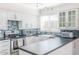 Well-lit kitchen featuring sleek countertops, updated stainless appliances, and backsplash at 6945 E Osborn Rd # B, Scottsdale, AZ 85251