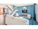 Bright living room with modern decor, open staircase, and stylish furnishings at 6945 E Osborn Rd # B, Scottsdale, AZ 85251