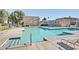Community pool area with clear blue water and plenty of lounge chairs for relaxation at 6945 E Osborn Rd # B, Scottsdale, AZ 85251