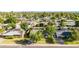 A tranquil neighborhood is revealed in this sunny aerial view of the home and lush landscaping at 743 W Ocotillo Rd, Phoenix, AZ 85013