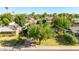 Well-maintained home with mature trees, front yard, and long driveway at 743 W Ocotillo Rd, Phoenix, AZ 85013
