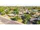 A tranquil neighborhood is revealed in this sunny aerial view of the home and lush landscaping at 743 W Ocotillo Rd, Phoenix, AZ 85013