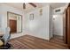 A bedroom featuring a ceiling fan, a mirror, and wood floors at 743 W Ocotillo Rd, Phoenix, AZ 85013