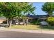 Charming single-story home with well-maintained front yard and mature trees at 743 W Ocotillo Rd, Phoenix, AZ 85013