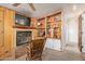 Wood paneled room with fireplace and built-in bookshelves at 743 W Ocotillo Rd, Phoenix, AZ 85013