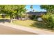 Beautiful home with a covered porch, lush lawn, and mature landscaping at 743 W Ocotillo Rd, Phoenix, AZ 85013