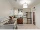 A kitchen with white cabinets, wooden countertops, a stainless steel refrigerator, and a gas range at 743 W Ocotillo Rd, Phoenix, AZ 85013