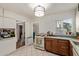 A kitchen featuring white cabinets, light fixtures, a gas range, wooden countertops and tile flooring at 743 W Ocotillo Rd, Phoenix, AZ 85013