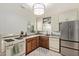 A kitchen featuring white cabinets, a gas range, wooden countertops, stainless steel refrigerator and tile flooring at 743 W Ocotillo Rd, Phoenix, AZ 85013
