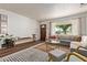Spacious living room with a comfortable sectional sofa, modern decor, and hardwood floors at 743 W Ocotillo Rd, Phoenix, AZ 85013