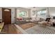 Bright living room featuring a large sectional sofa, stylish rugs, and natural light at 743 W Ocotillo Rd, Phoenix, AZ 85013