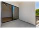 Contemporary balcony featuring glass sliding doors leading to bright, naturally lit interior at 8038 E Clarendon Ave, Scottsdale, AZ 85251