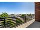 Balcony view with modern railings, offering views of the surrounding neighborhood at 8038 E Clarendon Ave, Scottsdale, AZ 85251