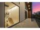 View from balcony showcasing stairwell through large picture window and a vibrant, colorful sunset sky at 8038 E Clarendon Ave, Scottsdale, AZ 85251
