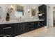 Elegant bathroom with a double sink vanity, sleek fixtures, and ample storage at 8038 E Clarendon Ave, Scottsdale, AZ 85251