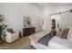 Bright bedroom featuring modern design elements and a comfortable sitting area at 8038 E Clarendon Ave, Scottsdale, AZ 85251