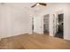 Bright bedroom showcasing hardwood floors, access to a shower room and large closet at 8038 E Clarendon Ave, Scottsdale, AZ 85251