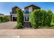 Beautiful modern two-story home with expertly landscaped front yard and sleek black accents at 8038 E Clarendon Ave, Scottsdale, AZ 85251