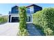 Striking modern two-story home featuring contemporary design and manicured landscaping at 8038 E Clarendon Ave, Scottsdale, AZ 85251