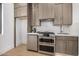 Well-equipped kitchen with stainless steel appliances, stylish cabinetry, and a bright countertop at 8038 E Clarendon Ave, Scottsdale, AZ 85251